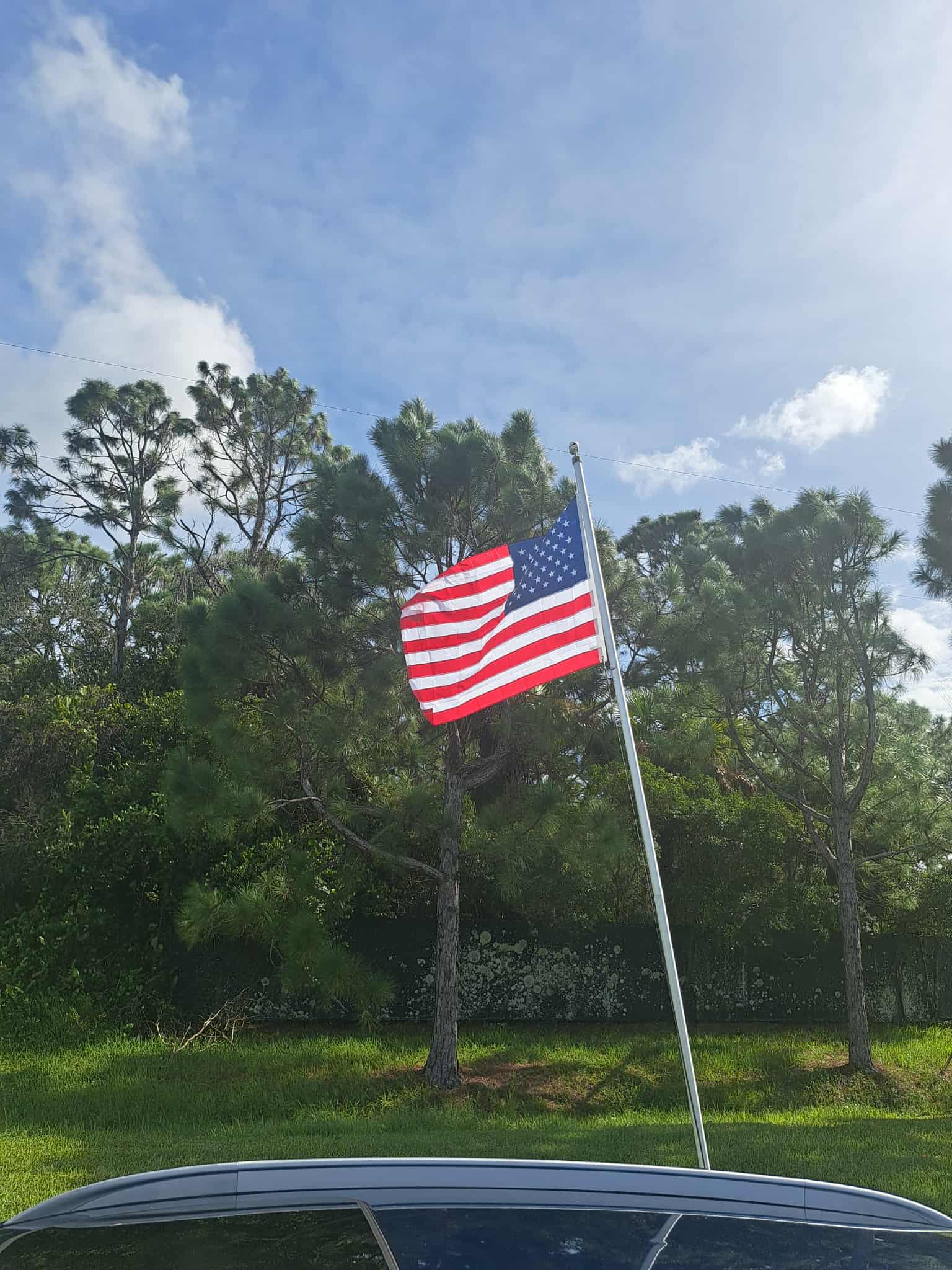 American flag waving at Twin Rivers RV Park